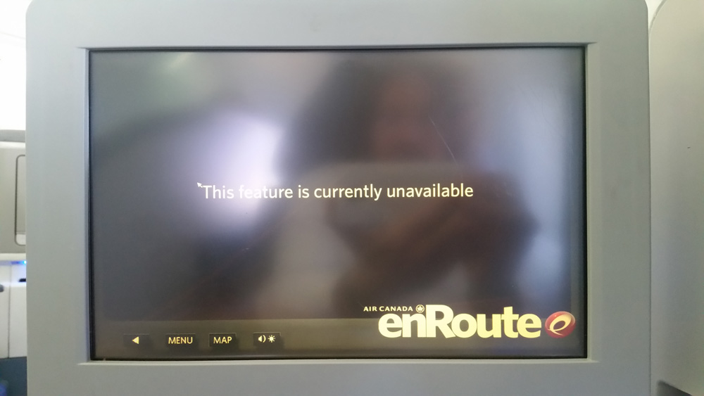 An image showing television screen with text displayed "The feature is currently unavailable"