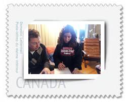 David’s niece and her father complete her Canadian citizenship papers at her grandparent’s coffee table PHOTO: DAVID BERMAN