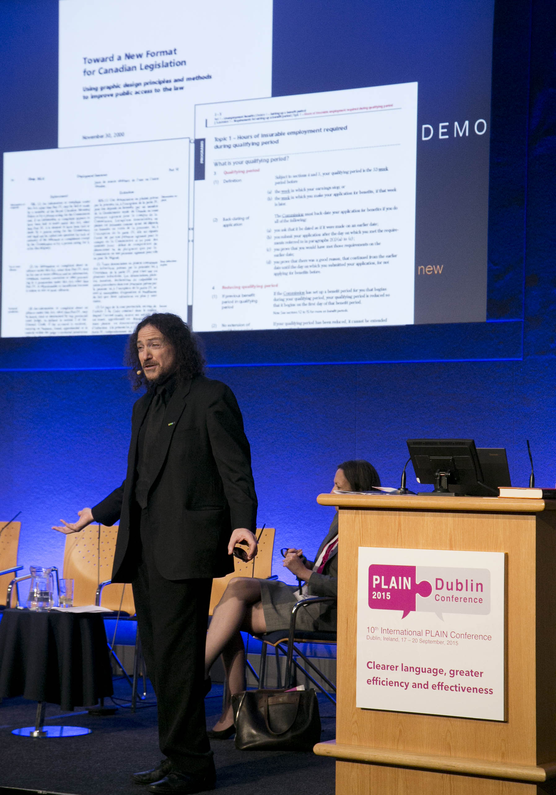 photo of David Berman speaking on stage at PLAIN 2015 Dublin podium