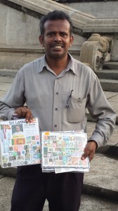 Photo of the Sri Lankan stamp seller showing his stamp collections.